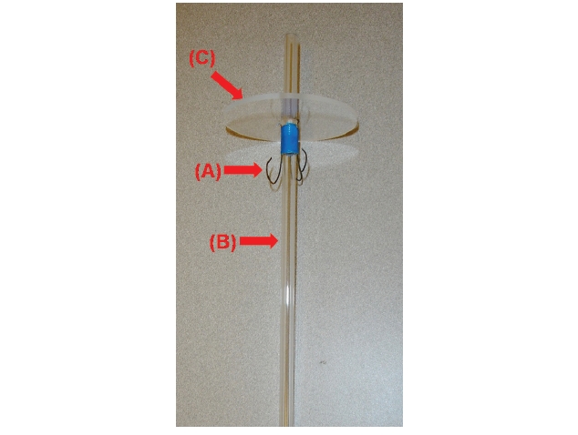 The wire hooks (A) are attached to Plexiglas air-tubing (B). The Plexiglas air-tubing is connected to a lid (C) that is set on a horizontal plate.