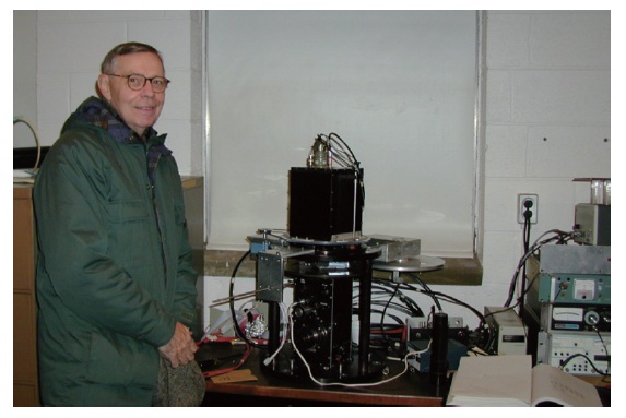 Robert H. Koch in 2000 standing by the remotely operable photoelastic modulating polarimeter.