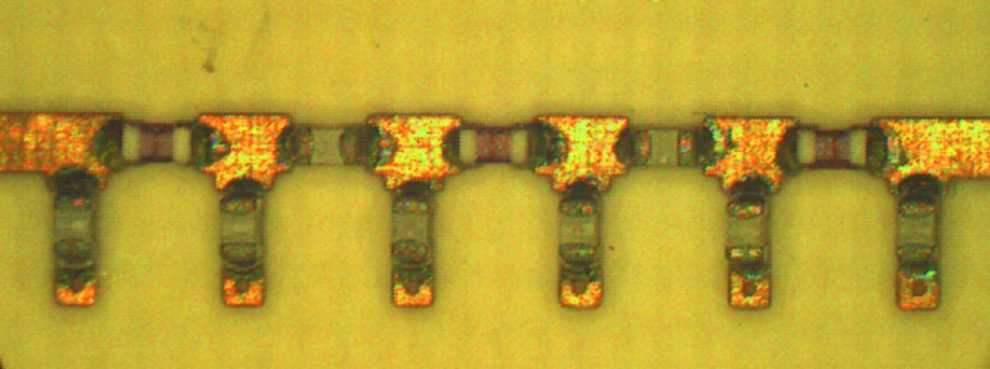 An example of a bulky bandpass filter (13.8 mm × 12.8 mm × 1.3 mm) using surface mountable chip inductors and capacitors on a printed circuit board.