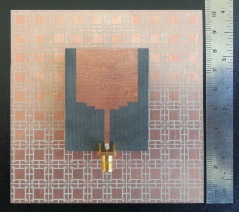 Fabricated dual-band monopole antenna over the artificial magnetic conductor surface.