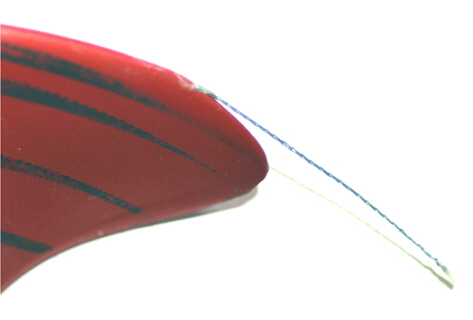 A propeller blade and the dyneema thread fixed at its tip