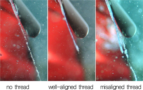 Instantaneous photographs of tip vortex cavitation with and without thread of 0.285mm diameter at J=0.97 and σ=5.63